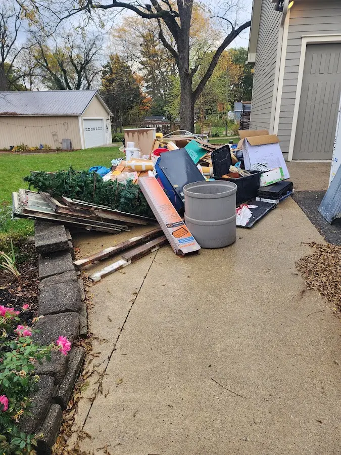Dumpster being loaded with debris for 3 Yard Dumpster Rental in La Habra